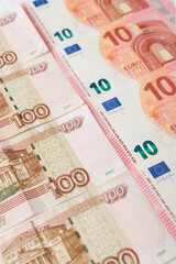 banknotes of the Russian ruble and euro banknotes lie exactly in a line. Economy. A crisis. Currency exchange