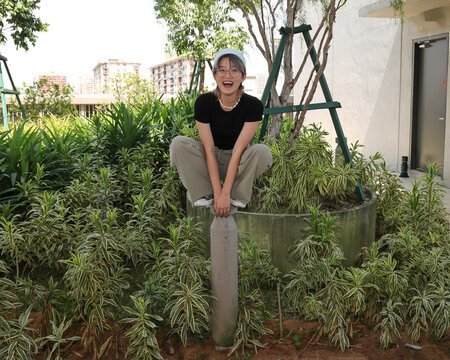 young attractive Asian group woman friends colleagues students garden plants hanging around enjoy photo pose fun happy