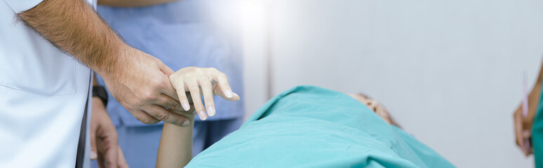 Doctors and medical students examining sick people banner.