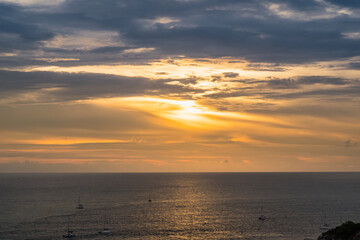 The sun is falling in sunset time at Promthep Cape in Phuket, Thailand.