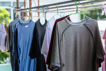 Close-up of freshly washed clothes hanging on a shelf. clothes line