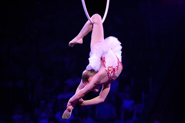 Baby girl aerialist performing under dome of circus. Kyiv, Ukraine © Yurii Zushchyk