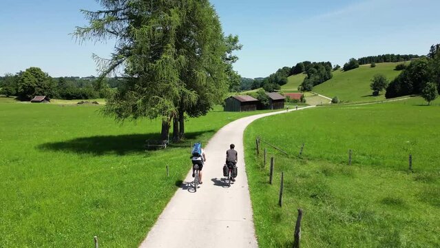 Cyclists riding through a hilly landscape in Bavaria