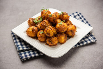 Homemade Roasted Bombay potatoes. Pan fried little baby potatoes or aloo with jeera seeds and coriander in bowl