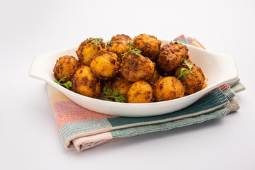 Homemade Roasted Bombay potatoes. Pan fried little baby potatoes or aloo with jeera seeds and coriander in bowl