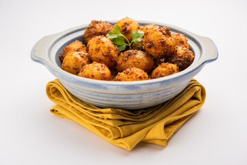 Homemade Roasted Bombay potatoes. Pan fried little baby potatoes or aloo with jeera seeds and coriander in bowl