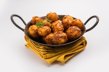 Homemade Roasted Bombay potatoes. Pan fried little baby potatoes or aloo with jeera seeds and coriander in bowl