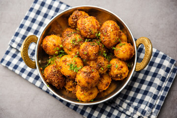 Homemade Roasted Bombay potatoes. Pan fried little baby potatoes or aloo with jeera seeds and coriander in bowl