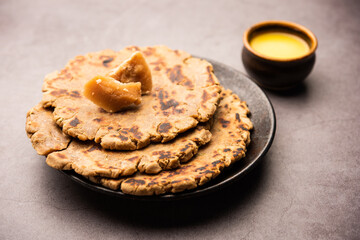 Sweet roti made out of rice flour, jaggery, and ghee. Gud ki roti. gur ki roti, jaggery Bhakri, meethi gud ki roti. Winter food. Copy space.