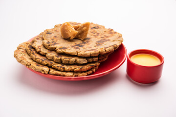 Sweet roti made out of rice flour, jaggery, and ghee. Gud ki roti. gur ki roti, jaggery Bhakri, meethi gud ki roti. Winter food. Copy space.