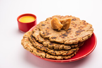 Sweet roti made out of rice flour, jaggery, and ghee. Gud ki roti. gur ki roti, jaggery Bhakri, meethi gud ki roti. Winter food. Copy space.
