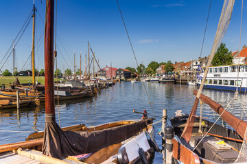 Traditional dutch wooden sailing ships in the harbor of Elburg, Netherlands