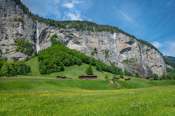 Spring landscape of  Lauterbrunnen valley, the Staubbach Fall  and the Lauterbrunnen Wall in Swiss...