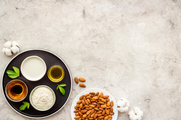 Sweet almond oil and milk with nuts seeds. Healthy food and cosmetic background