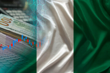 national flag of georgia on silk, dollar bills, computer, concept of global trading on the stock...