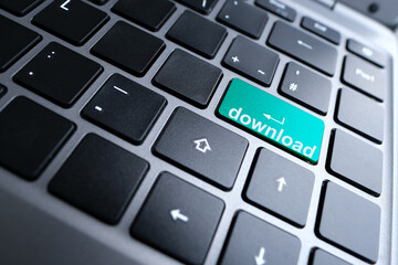 close-up part of a laptop, black keyboard of a laptop computer, green buttons with the word download, concept of installing and using new software, applications, games