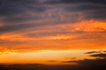 Fototapeta na wymiar sun ray is go down and amazing dramatic orange cloud