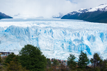 The huge size of Perito Moreno Glacier compare with people, Glaciers National Park, El Calafate in...