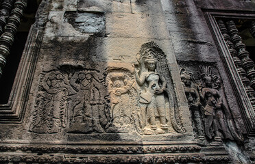 An unfinished carving of Apsara on sandstone is on the back wall on the east side of Angkor Wat in Siem Reap, Cambodia.
