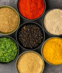 High quality close up photo of various spices with a dramatic concept.