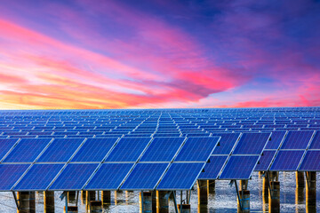 Solar power station at beautiful sunset. solar photovoltaic power station on water. green energy...