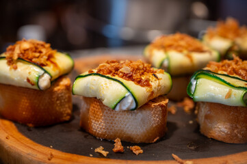 Typical snack of Basque Country and Navarre, pinchos or pinxtos served in bar, small slices of bread upon which ingredient or mixture of ingredients is placed, San Sebastian, Spain