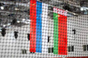 Flags of Russia and Belarus view through a black grid - the concept of closeness and prohibition - ban and isolation