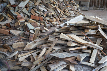 Closeup of dry firewood stack in firewood house