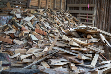 Closeup of dry firewood stack in firewood house