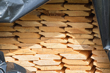 Stack of lumber from clapboard for finishing - pine clapboard