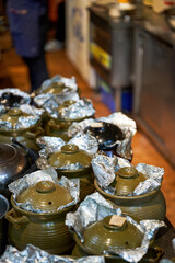 Chinese traditional ancient method of making soup, close-up of simmering soup in a clay pot