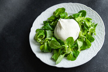 buratta salad green leaves mix fresh healthy meal food snack diet on the table copy space food background rustic top view