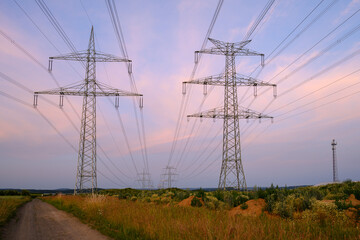 powerline and electicity cable in front of sunset