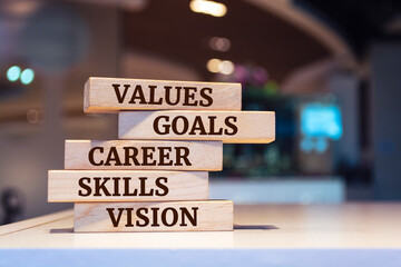 Wooden blocks with words 'Career, skills, values, vision, goal'. Business concept