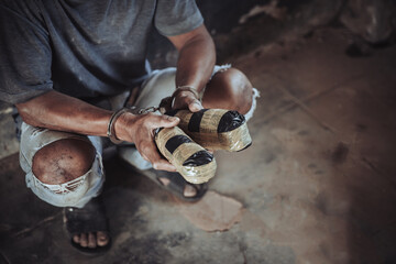 Police arrest drug trafficker with handcuffs.