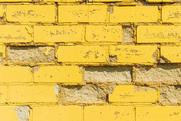 Yellow wall brick background texture photo.Background yellow brick wall.