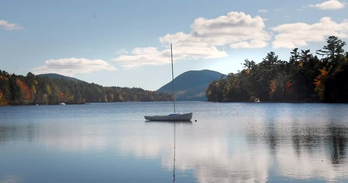 Small sailboat on the Long Pond in the Acadia National Park, Maine. Concept of tranquility and travel