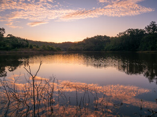 Lakeside Sunset with Cloud Reflections