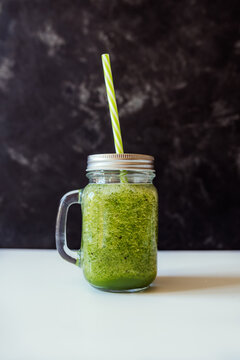 Healthy green smoothie in glass jar. Superfood