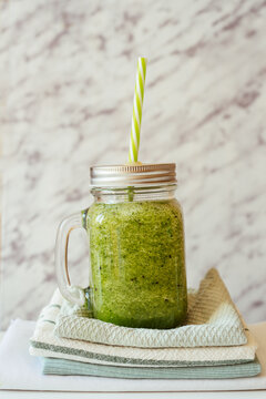 Healthy green smoothie in glass jar. Superfood
