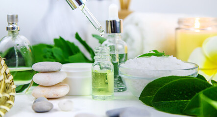 Background spa cosmetics and oils and herbs. Selective focus.
