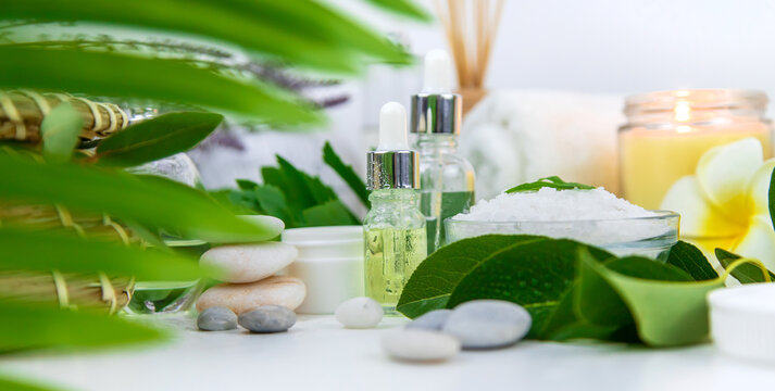 Background Spa Cosmetics And Oils And Herbs. Selective Focus.