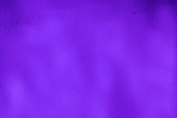 Purple colored wall background with textures of different shades of violet or purple