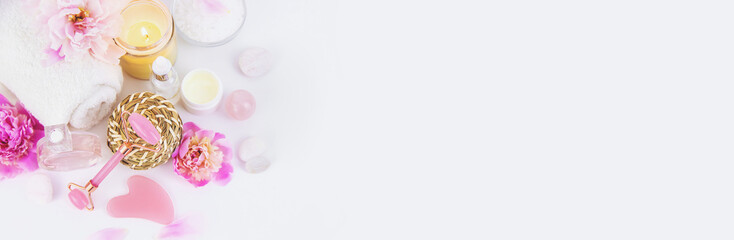 Pink flowers on white background spa facial. Selective focus.