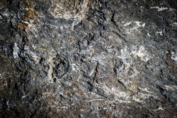 Gray stone texture background in grunge style. Mountain stones close up.