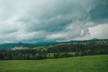 Austria, land of Styria. Beautiful mountain landscape in a mountain village after rain. The beautiful nature of Austria, the road in the mountains.