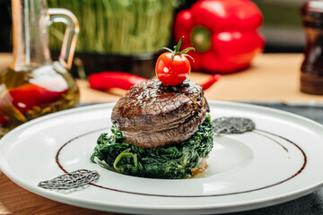 Medallions steaks from the beef tenderloin with spinach, Delicious balanced food concept