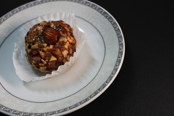 oriental sweets on a white plate black background