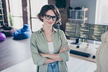 Photo of pretty friendly server optimization specialist crossed arms look camera loft room workplace