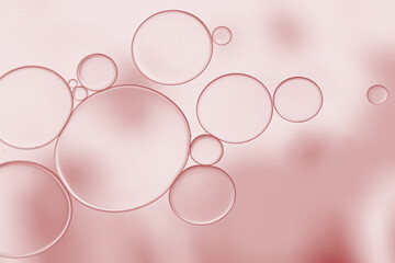 abstract background with bubbles on rose pink gradient.